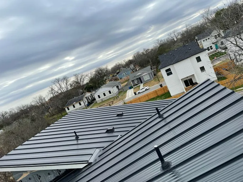Standing seam metal roof panels with vents for Skylight Repair in Skokie